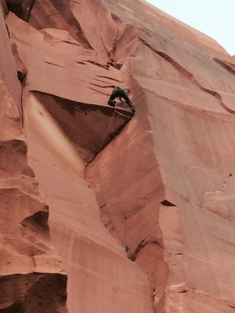 The author climbing Bulletproof Roof, Pistol Whipped Wall, Indian Creek. photo by Dane Molinaro